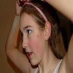 719376_tying_up_her__hair
