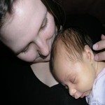 515055_closeup_picture_of_a_mother_kissing_her_infant