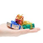 Gifts in a hand isolated on white background